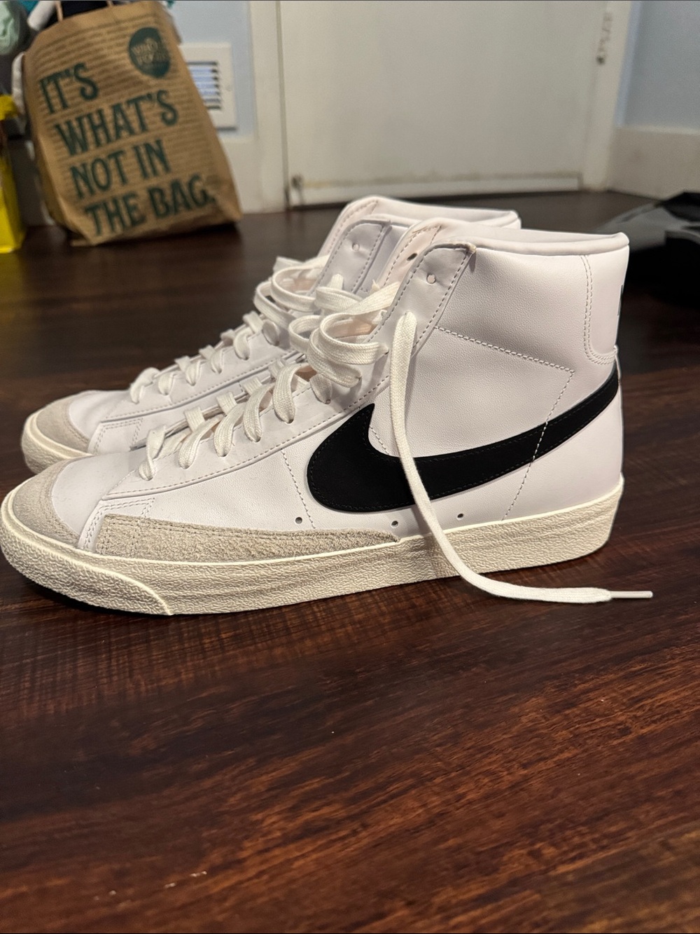 Nike White High-Top Sneakers with Black Swoosh